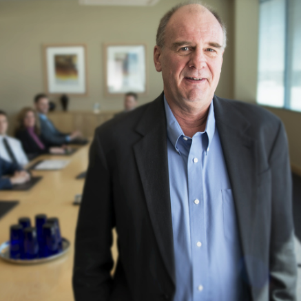 chief financial officer in front of table