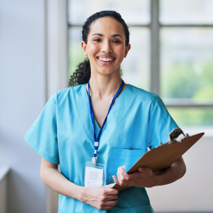 smiling female nurse with clipboard